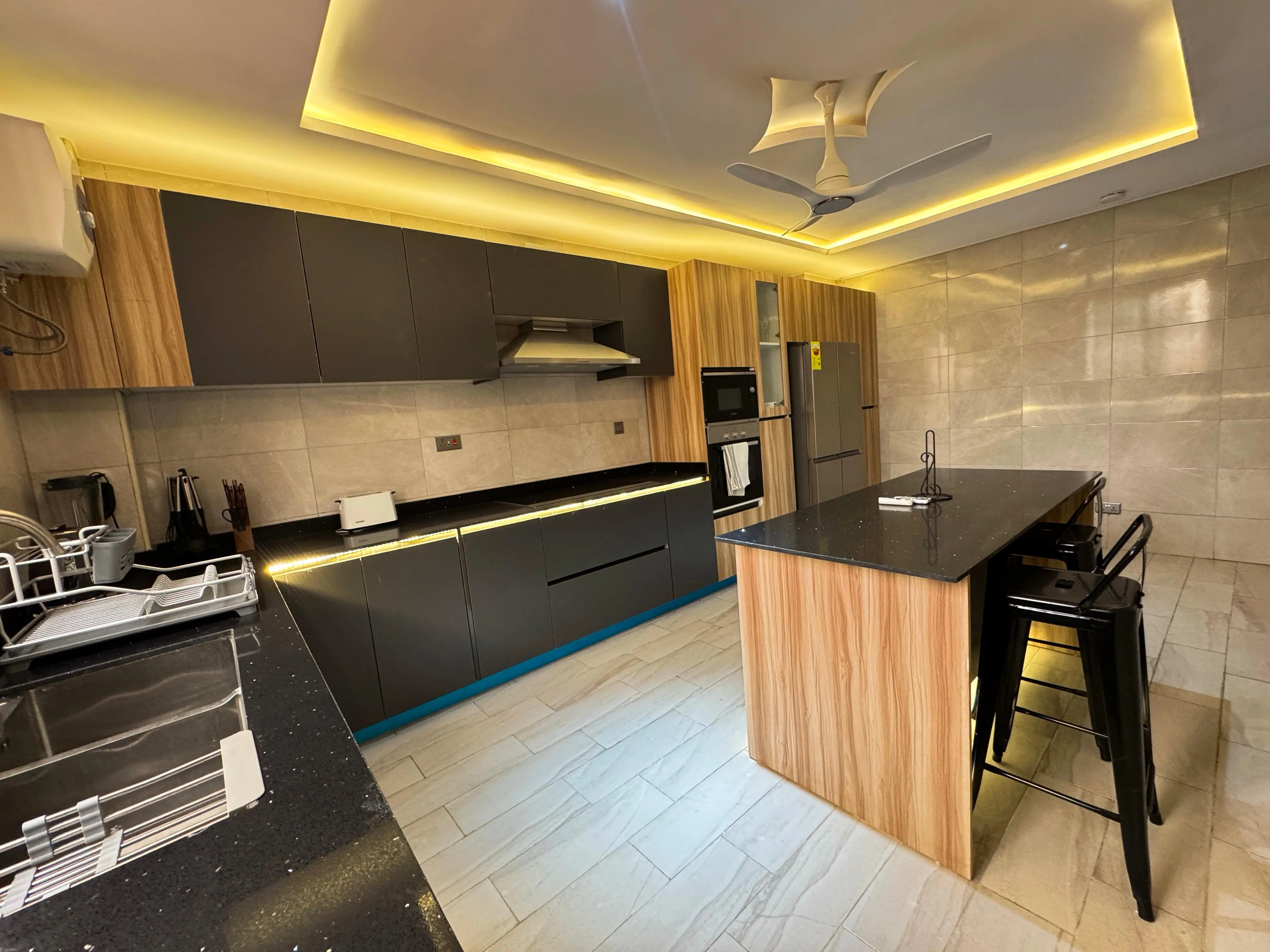 Modern kitchen with island and warm lighting